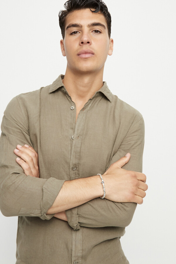 PULSERA ELÁSTICA DE ALEACIÓN DE METALES BAÑADA EN PLATA CON DETALLE DE CALAVERA Pulsera