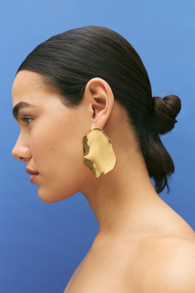 Caravanas de acero dorado